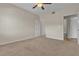 Large empty bedroom with neutral walls and carpet flooring at 7701 W Robindale Rd # 102, Las Vegas, NV 89113