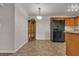 Open dining area featuring tile flooring and a black refrigerator at 7701 W Robindale Rd # 102, Las Vegas, NV 89113