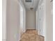 A hallway with tile flooring leading to other rooms at 7701 W Robindale Rd # 102, Las Vegas, NV 89113