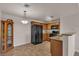 Stylish eat-in kitchen featuring wood cabinetry, modern appliances, and ample counter space at 7701 W Robindale Rd # 102, Las Vegas, NV 89113