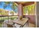 Cozy balcony featuring a table with chairs, offering a relaxing outdoor space at 8000 W Badura Ave # 1019, Las Vegas, NV 89113