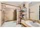 Bathroom featuring a shower, bathtub, and vanity with a decorative curtain at 8000 W Badura Ave # 1019, Las Vegas, NV 89113