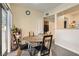 A dining area with a unique table and chairs with a view through the sliding glass door at 8000 W Badura Ave # 1019, Las Vegas, NV 89113