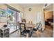 Bright dining area featuring a table with chairs and a view of the outdoor balcony at 8000 W Badura Ave # 1019, Las Vegas, NV 89113