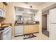 A well-lit kitchen with modern appliances and convenient breakfast bar at 8000 W Badura Ave # 1019, Las Vegas, NV 89113