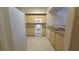 Well-equipped kitchen featuring white appliances and light wood cabinetry at 8000 W Badura Ave # 1019, Las Vegas, NV 89113