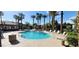 Resort-style swimming pool with ample lounge chairs, clear blue water, and lots of sunshine at 8000 W Badura Ave # 1019, Las Vegas, NV 89113