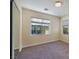 Bedroom with neutral carpet, standard closets, and bright windows at 8234 Misty Sage St, Las Vegas, NV 89139