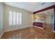 Open concept living space featuring wood floors, plantation shutters, view of the eat-in kitchen at 8234 Misty Sage St, Las Vegas, NV 89139