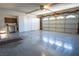 Spacious garage with ample storage cabinets, workbench and large garage door at 8262 Huxley St, Las Vegas, NV 89123