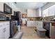 Functional kitchen with white cabinets, modern appliances, and a tile backsplash, maximizing space and efficiency at 8262 Huxley St, Las Vegas, NV 89123