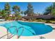 Backyard features a refreshing swimming pool and well-maintained landscaping for outdoor enjoyment and relaxation at 8262 Huxley St, Las Vegas, NV 89123