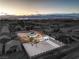 Wide shot emphasizing a property’s desert landscaping, mountain views, pool, and the surrounding residential neighborhood at 8645 Edmond St, Las Vegas, NV 89139