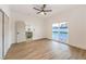 Bright bedroom with sleek ceiling fan and sliding glass doors to yard at 8645 Edmond St, Las Vegas, NV 89139