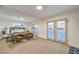 Spacious bedroom featuring French doors that lead outside with cozy chairs at 8645 Edmond St, Las Vegas, NV 89139