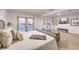 Bright bedroom with white walls, carpet floors, and double doors leading to the outside at 8645 Edmond St, Las Vegas, NV 89139