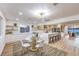 A dining space sits next to a modern kitchen with an island and stainless steel appliances at 8645 Edmond St, Las Vegas, NV 89139