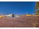 Spacious land parcel with potential, featuring open space and nearby utilities for building at 8645 Edmond St, Las Vegas, NV 89139