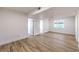 Bright living room featuring durable wood-style flooring and large window at 8645 Edmond St, Las Vegas, NV 89139