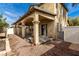 Wide backyard patio with arched pillars, low maintenance yard, and access to the house at 8699 Grand Sequoia St, Las Vegas, NV 89139