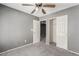 Carpeted bedroom with connected closet and another bedroom at 8699 Grand Sequoia St, Las Vegas, NV 89139