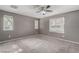 Bedroom with carpet flooring, natural light from multiple windows, and neutral wall paint at 8699 Grand Sequoia St, Las Vegas, NV 89139