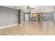 Bright and airy living room with tile floors, neutral colors, and open access to the kitchen area at 8699 Grand Sequoia St, Las Vegas, NV 89139