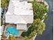 Aerial view of a backyard featuring a pool and spa surrounded by mature trees at 8800 Las Olivas Ave, Las Vegas, NV 89147