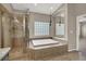 Relaxing bathroom features a soaking tub and separate glass-enclosed shower at 8800 Las Olivas Ave, Las Vegas, NV 89147