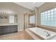 Bathroom featuring a soaking tub and walk in glass shower at 8800 Las Olivas Ave, Las Vegas, NV 89147