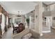 Elegant dining room adjacent to a curved staircase, offering ample space for gatherings and entertaining at 8800 Las Olivas Ave, Las Vegas, NV 89147