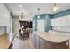 Open-concept kitchen with granite island and stainless steel appliances, connecting to the dining area at 8800 Las Olivas Ave, Las Vegas, NV 89147