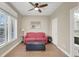 Bright living room with wood-look floors, modern ceiling fan and comfortable seating at 8800 Las Olivas Ave, Las Vegas, NV 89147