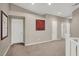 Open loft space with neutral walls and carpet at 8800 Las Olivas Ave, Las Vegas, NV 89147