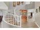 View of staircase with white railing and hardwood floors at 8800 Las Olivas Ave, Las Vegas, NV 89147