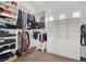 Organized walk-in closet with shelving and hanging rods for optimal storage at 8800 Las Olivas Ave, Las Vegas, NV 89147