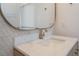 Close-up of a stylish bathroom vanity featuring a marble countertop, elegant sink, and modern faucet fixtures at 9101 Alta Dr # 207, Las Vegas, NV 89145