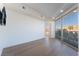 Bright living room with floor to ceiling windows and doors leading out to a private patio with ornate railings at 9101 Alta Dr # 207, Las Vegas, NV 89145