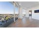 Bright living room with floor to ceiling windows and doors leading out to a private patio with ornate railings at 9101 Alta Dr # 207, Las Vegas, NV 89145