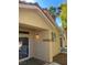 Backyard of home featuring stucco walls, exterior light, and mature trees at 9286 Blue Flax Pl, Las Vegas, NV 89148