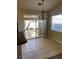 Cozy dining area with a chandelier, sliding door to the yard, and natural light at 9286 Blue Flax Pl, Las Vegas, NV 89148