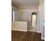 Inviting living room featuring a blend of tile and wood flooring at 9286 Blue Flax Pl, Las Vegas, NV 89148