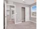 Bright bedroom with carpet, closet, and neutral tones, creating a comfortable space at 9330 Brookmont Ave, Las Vegas, NV 89149