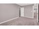 Comfortable bedroom featuring carpeted floors, neutral walls, closet, and a bright window at 9330 Brookmont Ave, Las Vegas, NV 89149