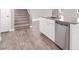 Modern kitchen island featuring granite countertop and stainless steel dishwasher at 9330 Brookmont Ave, Las Vegas, NV 89149