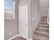 Carpeted staircase leads to the upper level of the home at 9330 Brookmont Ave, Las Vegas, NV 89149