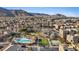 Aerial view of the neighborhood, community pool, park and mountain views at 10525 Gibbous Moon Dr, Las Vegas, NV 89129