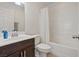 Bathroom featuring a dark vanity with light countertop, complemented by a shower and bathtub at 10525 Gibbous Moon Dr, Las Vegas, NV 89129