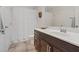 Bathroom featuring dark wood cabinetry, modern fixtures, and a clean, well-lit space at 10525 Gibbous Moon Dr, Las Vegas, NV 89129