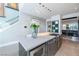 Modern kitchen island with stainless steel appliances and stylish finishes at 10605 Harvest Green Way, Las Vegas, NV 89135